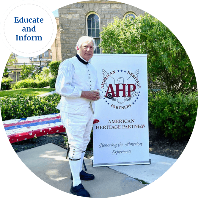 Jay Dickey standing in revolutionary period clothing by the American Heritage Partners banner image with logo.